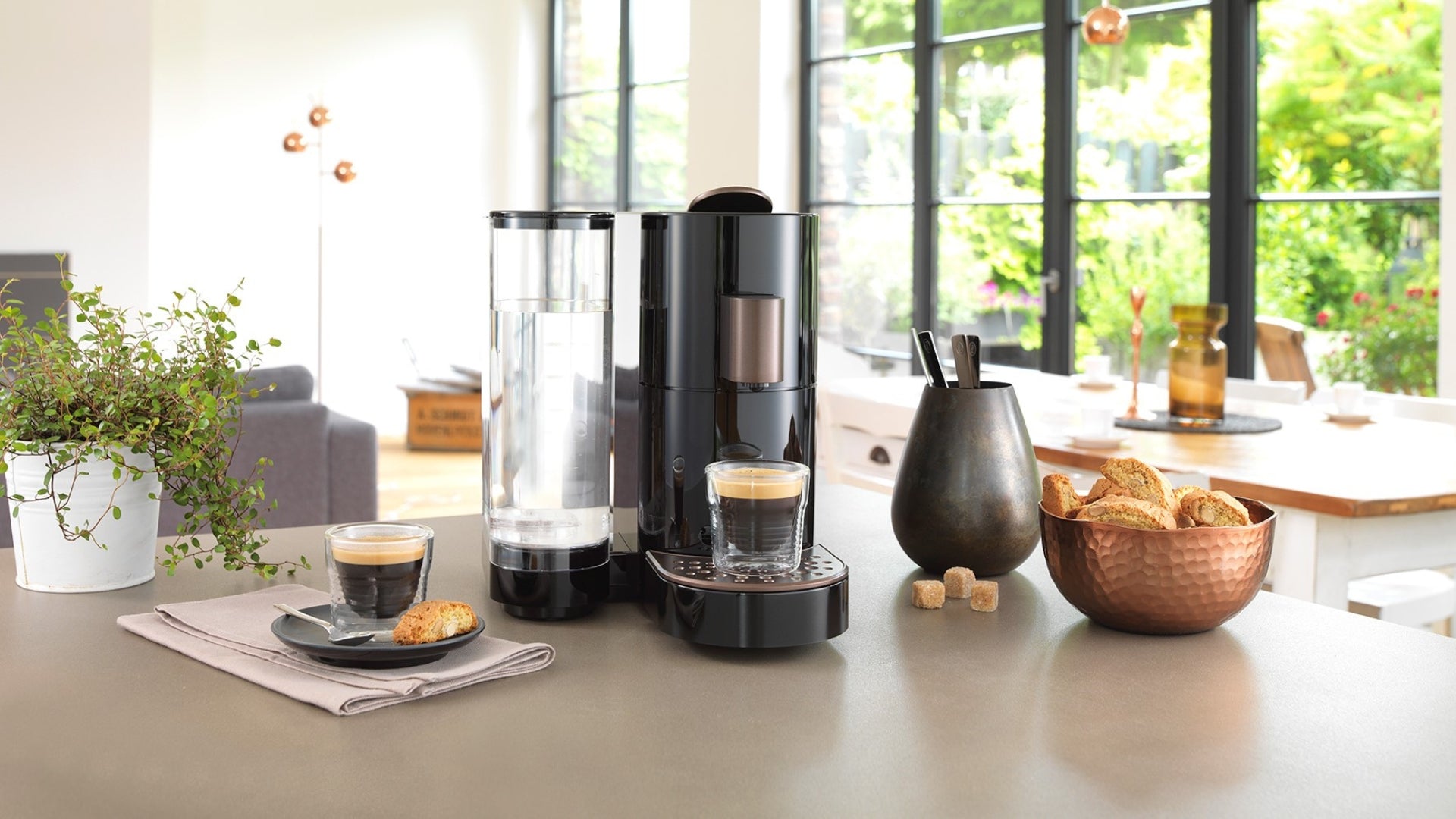 Compact capsule coffee machine suitable for homes, hotel guest rooms, boardrooms and showrooms.