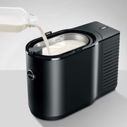 Side profile of Jura 2.5L milk cooler with soft-close magnetic lid open for refilling