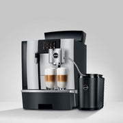 Jura 2.5L Cool Control connected to a bean-to-cup coffee machine in a café setting
