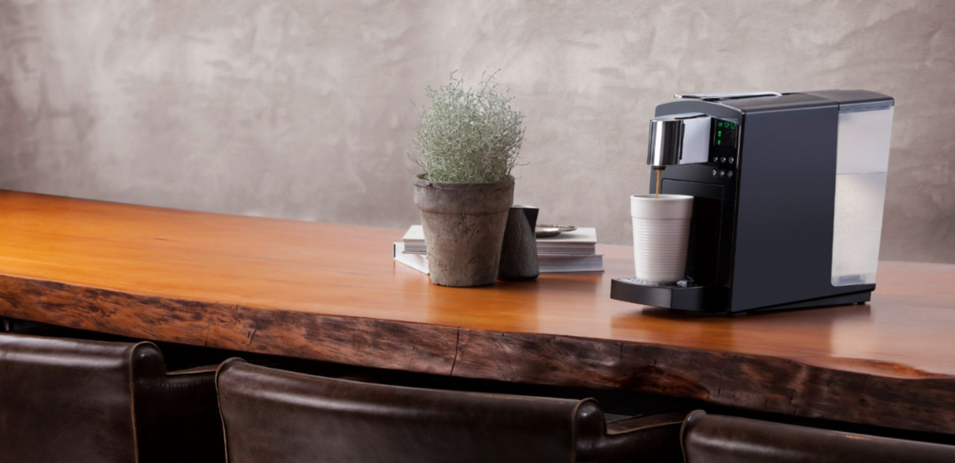 Sleek K-Fee capsule coffee machine - premium coffee and hot drinks in a boardroom or showroom refreshment area